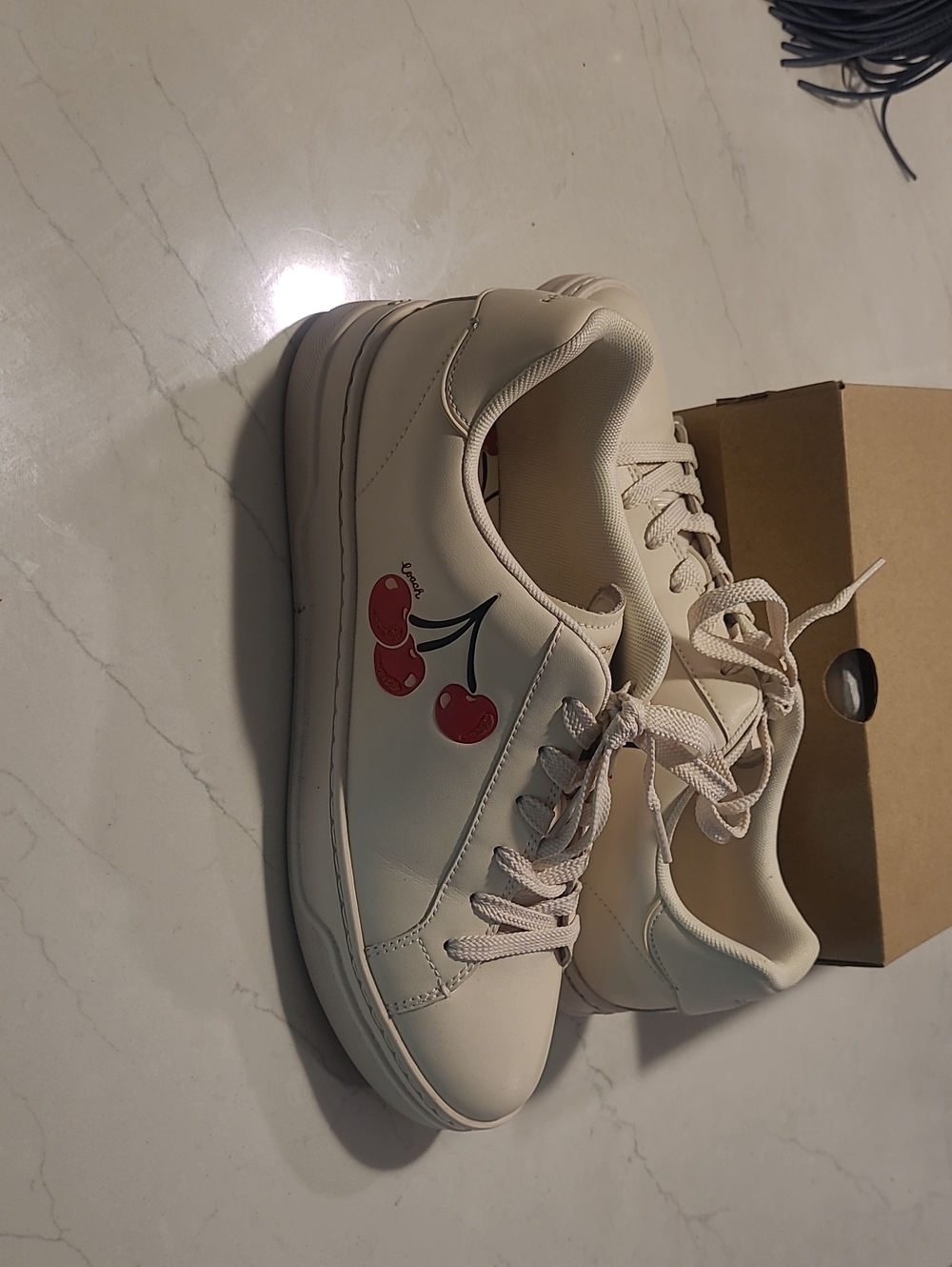 Coach Cream Leather Low-Top Sneakers with Red Cherry Accent